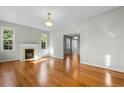 Open living room with hardwood floors and access to other rooms at 432 N Smith Rd., Mullins, SC 29574