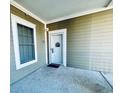 Private condo entryway with a welcoming door and exterior lighting at 4883 Luster Leaf Circle # 204, Myrtle Beach, SC 29577