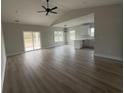Spacious living room features hardwood floors and a view of the backyard at 3854 Red Bluff Rd., Loris, SC 29569