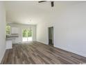 Spacious living room featuring hardwood floors and high ceilings at 3858 Red Bluff Rd., Loris, SC 29569