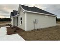 Newly constructed home with neutral siding and landscaping at 3858 Red Bluff Rd., Loris, SC 29569