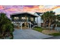 Two-story home with a modern exterior at 324 54Th Ave. N, North Myrtle Beach, SC 29582