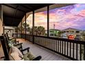 Covered porch with rocking chairs and sunset view at 324 54Th Ave. N, North Myrtle Beach, SC 29582