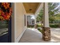 Inviting front porch with stone columns and a lovely wreath at 4402 Boxwood St., Myrtle Beach, SC 29577