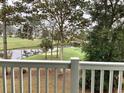 Balcony view overlooking a golf course, pond, and trees at 703 Riverwalk Dr. # 304, Myrtle Beach, SC 29579