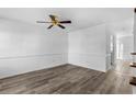 Simple living room with laminate floors and ceiling fan at 2925 Carriage Row Ln. # 134, Myrtle Beach, SC 29577