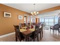 Dining room with a wooden table and chairs, overlooking ocean at 2709 Ocean Blvd. S # 1202, Myrtle Beach, SC 29577