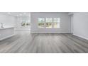 Spacious living area with vinyl plank flooring and abundant natural light at 680 Blackthorne Circle Nw, Calabash, NC 28467