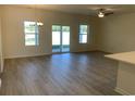 Spacious great room with vinyl flooring and access to the backyard at 1744 Register Dr, Conway, SC 29527