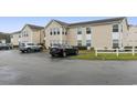 Exterior of building with cars parked nearby at 8546 Hopkins Circle # G, Surfside Beach, SC 29575