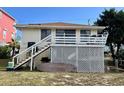 Raised beach cottage with deck and lattice at 848 S Waccamaw Dr., Garden City Beach, SC 29576