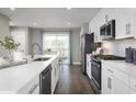 Modern kitchen with white cabinets and stainless steel appliances at 2760 Rowyn St., Longs, SC 29568