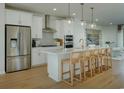 Modern kitchen with island, stainless steel appliances, and white cabinets at 8481 Duke Pl. # 35, Myrtle Beach, SC 29572