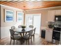 Charming dining area with round table and six chairs, near kitchen at 309 21St Ave. N, North Myrtle Beach, SC 29582