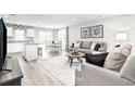 Open concept living room and kitchen with modern design at 3006 Nw Edgemead Circle # B, Calabash, NC 28467