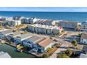 Aerial view of beachfront property showing ocean, home, and surrounding buildings at 4801 North Ocean Blvd. # 3N, North Myrtle Beach, SC 29582