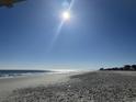 Expansive beach with ocean waves and clear sky; tire tracks on the sand at 700 N Waccamaw Dr. # 319, Garden City Beach, SC 29576