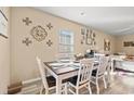 Dining room with a table and chairs, decorative wall art, and natural light at 1099 Saltgrass Way, Myrtle Beach, SC 29588