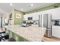 Modern kitchen with granite countertops and stainless steel appliances at 1099 Saltgrass Way, Myrtle Beach, SC 29588