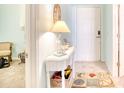 Charming entryway with white console table, coastal decor, and tile floor at 5102 Sweetwater Blvd., Murrells Inlet, SC 29576