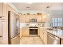 Well-equipped kitchen with stainless steel appliances and light wood cabinets at 5102 Sweetwater Blvd., Murrells Inlet, SC 29576