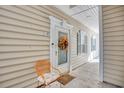 Inviting building entrance with autumnal wreath and seating at 5102 Sweetwater Blvd., Murrells Inlet, SC 29576