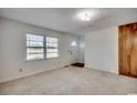 Spacious living room with large windows and carpeted floors at 3701 South Green Sea Rd., Loris, SC 29569