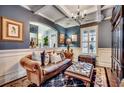 Elegant living room with leather furniture and decorative accents at 713 Shell Point Ct., Longs, SC 29568