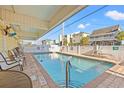 Inviting community pool with ample seating at 301 N Waccamaw Dr. # 206, Murrells Inlet, SC 29576