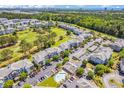 Aerial view of community with pool, golf course, and numerous buildings at 4893 Magnolia Pointe Ln. # 305, Myrtle Beach, SC 29577
