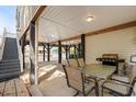 Covered patio area with water views, table and grill at 6001-G3 S Kings Hwy., Myrtle Beach, SC 29575