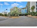 Resort building exterior with parking and landscaping at 1105 S Ocean Blvd. # 106, Myrtle Beach, SC 29577