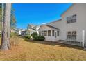 Townhouse backyard with screened porch and small lawn area at 493 Shellbank Dr. # 2-B, Longs, SC 29568