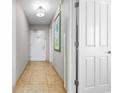 Condo hallway with tiled floor and white doors at 5200 N Ocean Blvd. # 1231, Myrtle Beach, SC 29577