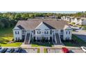Aerial view of a community of tan buildings with parking and landscaping at 111 Portsmith Dr. # 6, Myrtle Beach, SC 29588