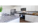Modern kitchen with stainless steel appliances and granite countertops at 510 Firouz Dr, Longs, SC 29568
