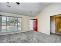 Living room with gray carpet, red front door, and neutral walls at 4336 Summitt Trail, Myrtle Beach, SC 29579