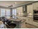 Large kitchen island with granite countertop and seating for four at 845 Waterton Ave., Myrtle Beach, SC 29579