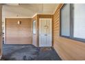 Exterior condo entry door with welcome mat at 410 Melrose Pl. # 305, Myrtle Beach, SC 29572