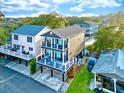 Elevated home with large deck, showcasing ocean views and neighborhood at 6001 - 1191 S Kings Hwy., Myrtle Beach, SC 29575