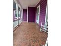 Spacious front porch with tile flooring and rocking chair at 206 Lakeland Dr., Conway, SC 29526