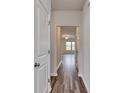 Bright hallway with wood-look floors and access to other rooms at 219 Sundrop Way, Conway, SC 29526