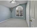 Bedroom with carpet, large window, and double closet at 4542 Mandi Ave., Little River, SC 29566