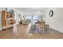 Bright dining area with wood floors and coastal decor at 8500 Margate Circle # 1104, Myrtle Beach, SC 29572