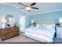 Spacious bedroom with light blue walls and a king-size bed at 204 Sundrop Way, Conway, SC 29526