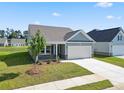 New single-Gathering home with gray siding and stone accents at 2480 Campton Loop, Conway, SC 29527