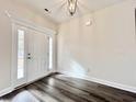 Bright entryway with hardwood floors and a white door at 4959 Old Highway 90, Conway, SC 29526