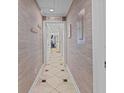 Hallway with patterned walls and tiled floor at 202 75Th Ave N # 5702/5703, Myrtle Beach, SC 29572
