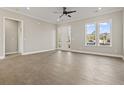 Spacious living room with wood-look flooring and ample natural light at 270 Russ Rd., Loris, SC 29569