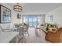 Bright living room with ocean view and dining area at 2711 S Ocean Blvd. # 920, North Myrtle Beach, SC 29582